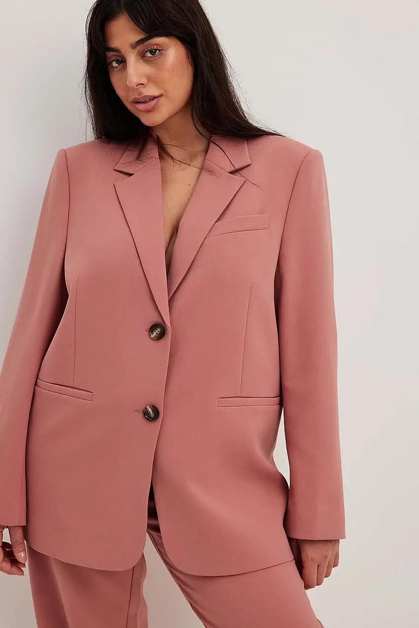 Melerad oversized blazer med snitt på kragen Rosa
